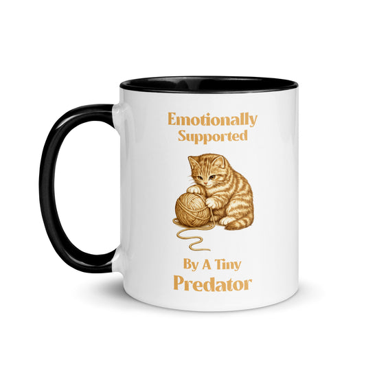 Emotionally Supported By A Tiny Predator cat mug with playful kitten design